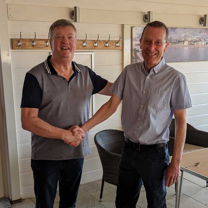 Photo of Simon Mount, Empire Finance being welcomed to the club by chairman, Michael Cannon